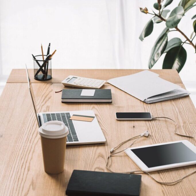 close up view of workplace with laptop coffee to 2021 09 03 07 42 24 utc scaled 1